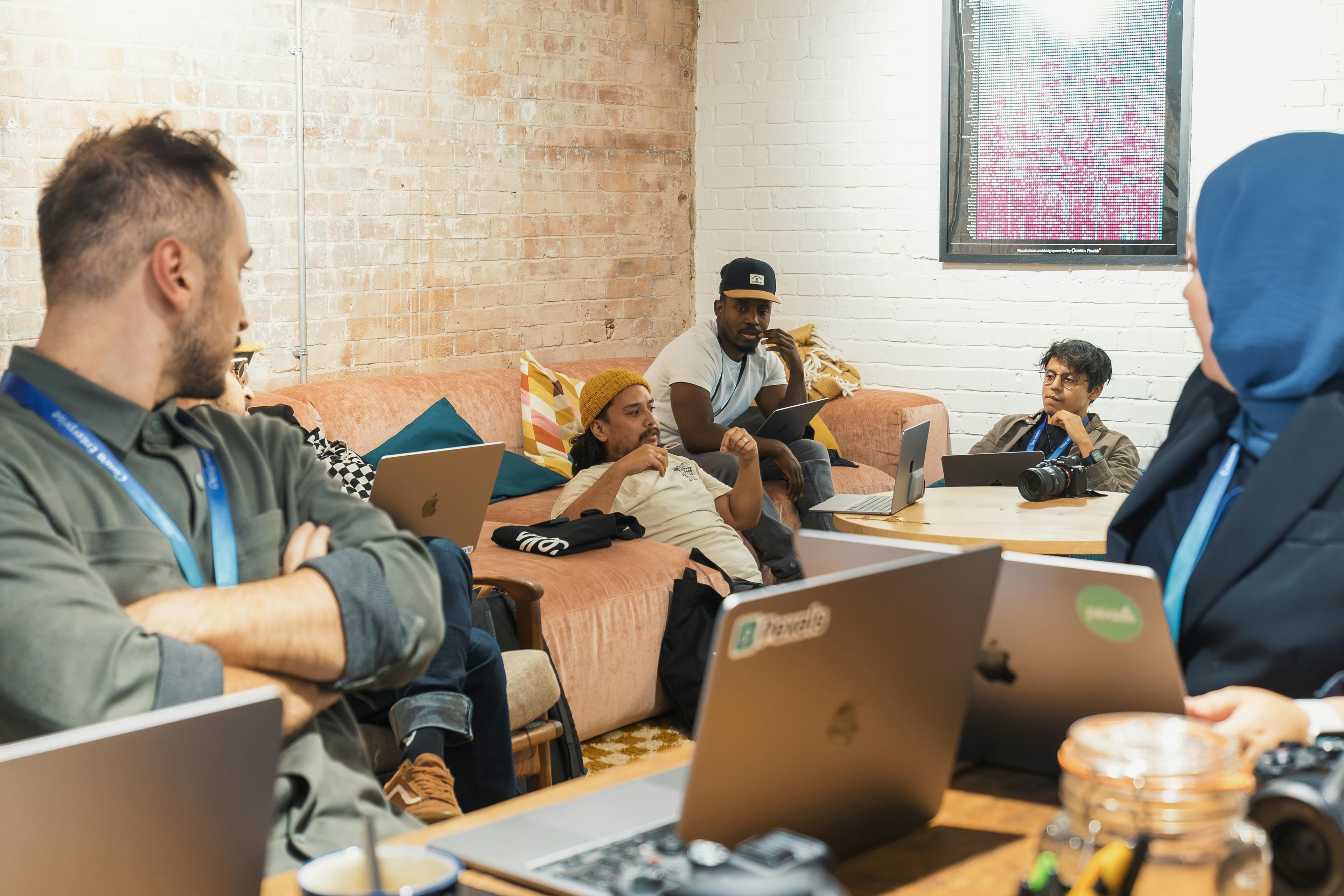 Team gathered around laptops during a planning discussion